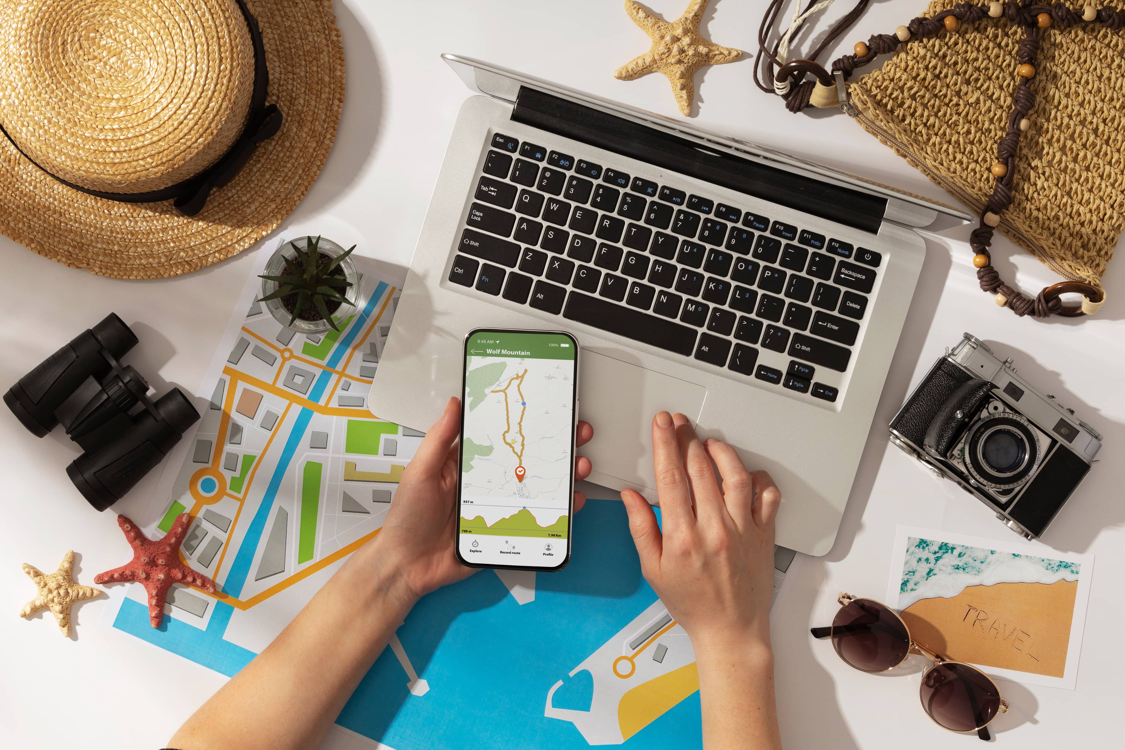 A person planning a trip on a laptop