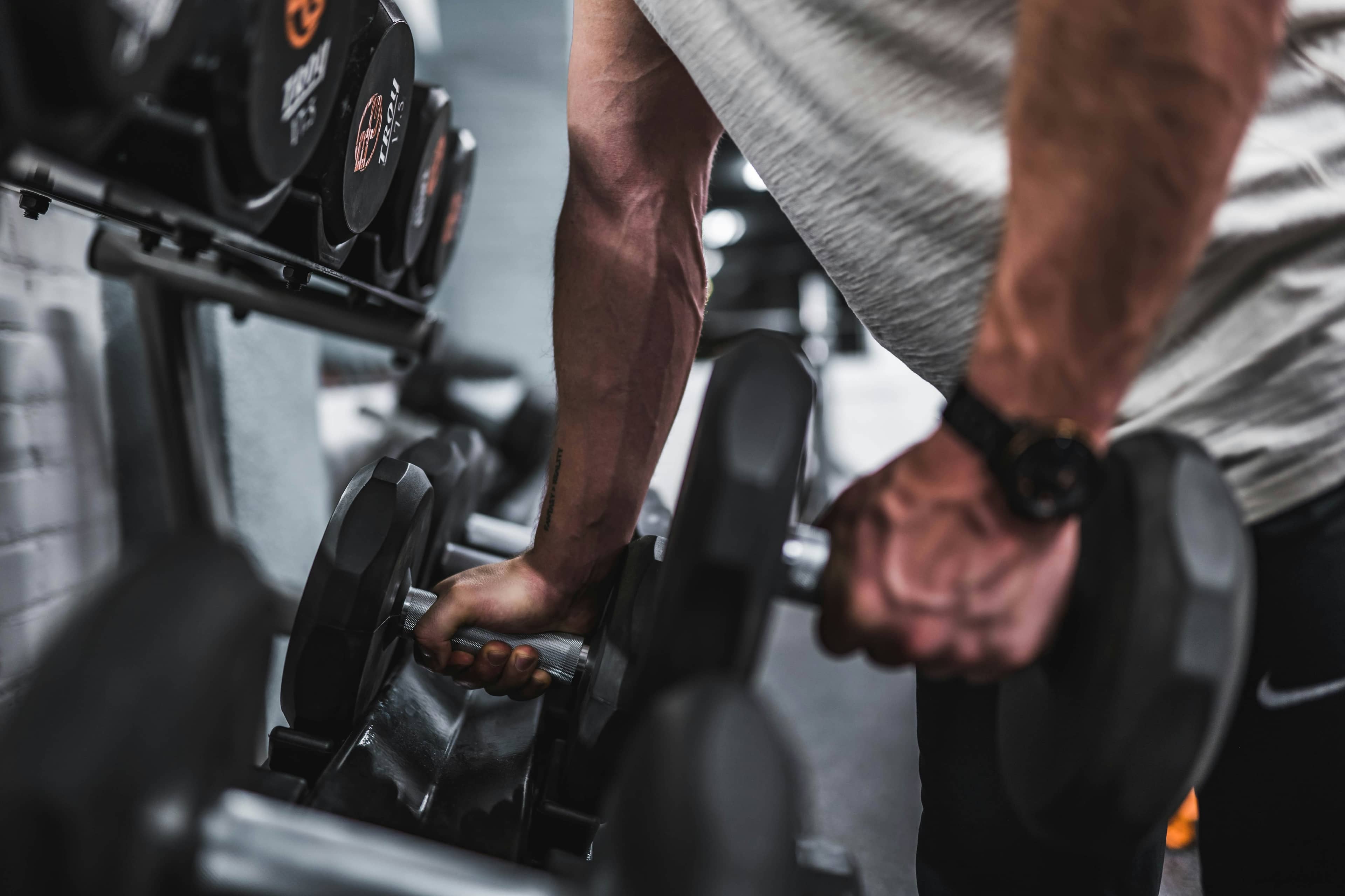 Man using weights at a gym